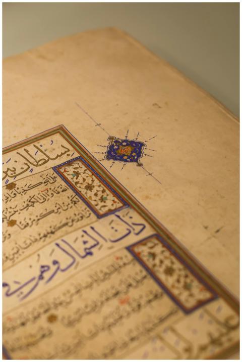 Old Arabic manuscript featuring elaborate calligra