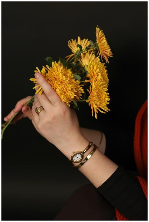 Elegant close-up of a woman's hand holding bright