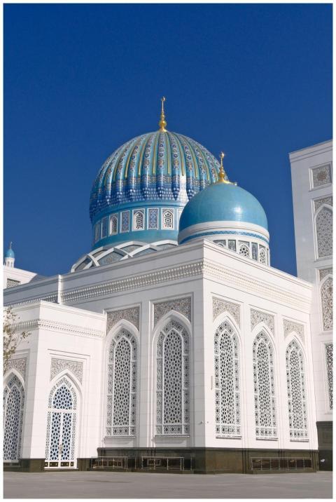 Magnificent blue dome of a mosque under clear blue