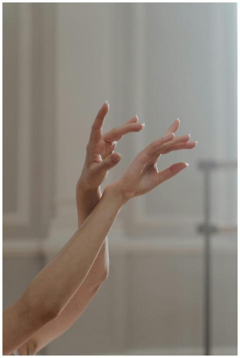 Close-up of a ballet dancer's hands captured in an