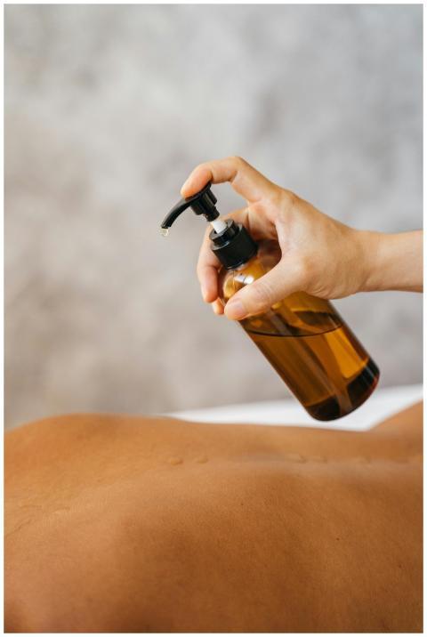 A relaxing massage with oil, showcasing a therapis