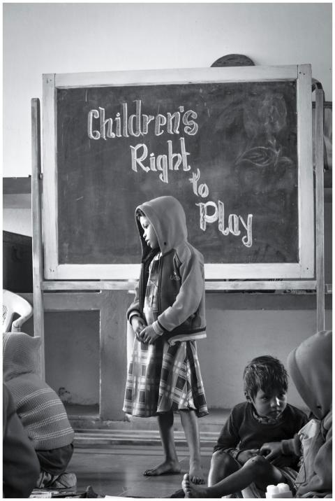 Black and white image of children in a classroom a