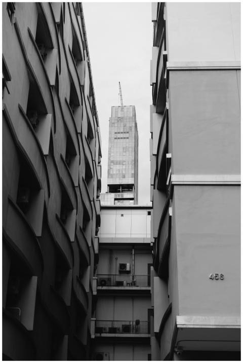 Black-and-white photo of urban buildings highlight