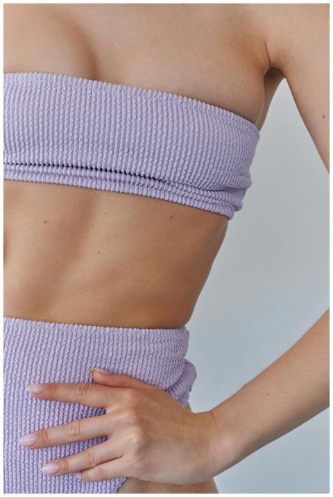 Close-up of a woman's waist showcasing fitness and