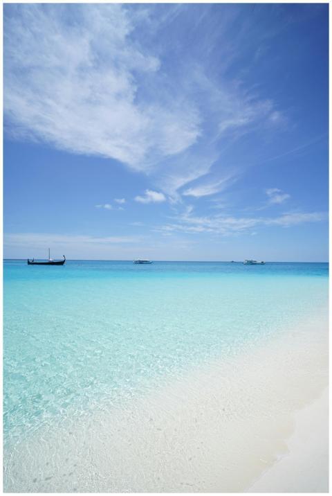 Peaceful beach scene with crystal clear waters and