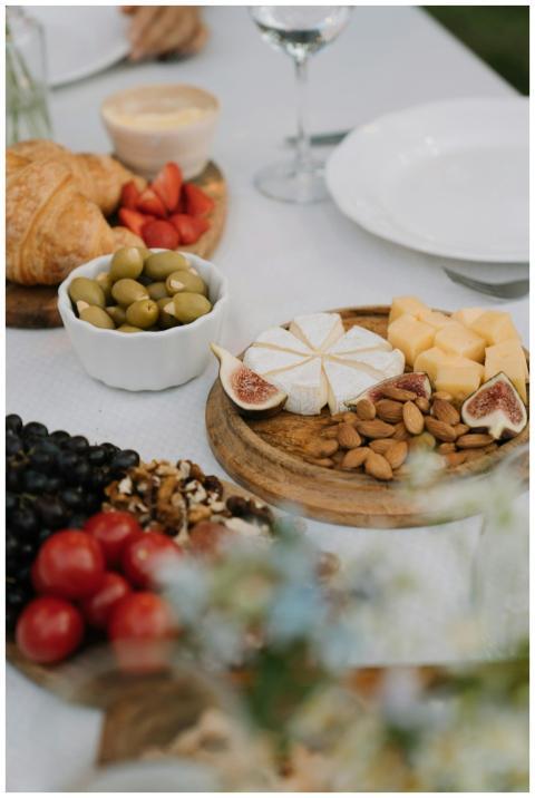 A variety of cheeses, fruits, and nuts elegantly a