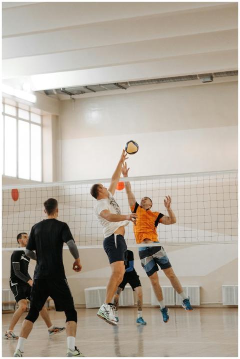 Intense moment captured as volleyball players jump