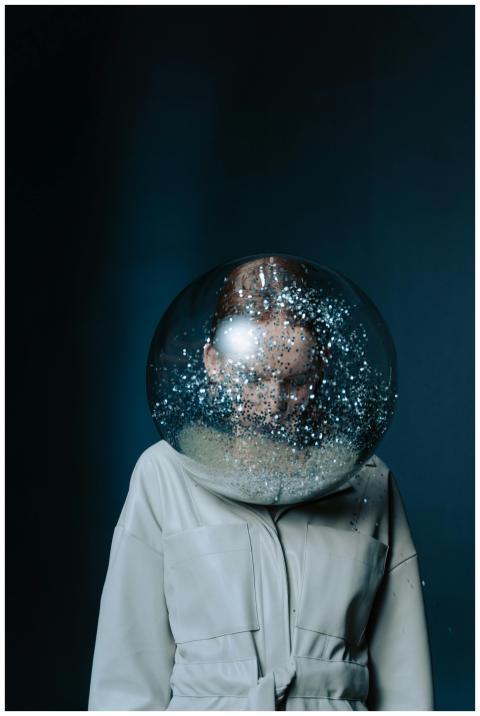 A conceptual portrait of a person wearing a glitte