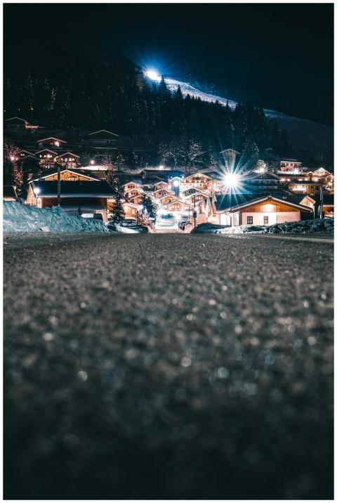 Charming winter night scene with illuminated homes