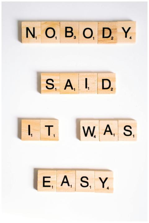 Scrabble tiles spelling 'Nobody said it was easy'