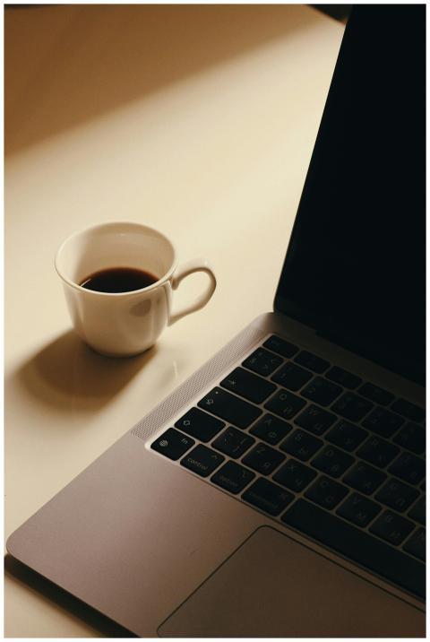 A minimalist workspace featuring a cup of coffee n