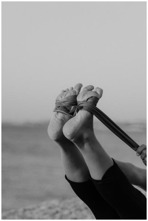 Black and white image of a stretching exercise usi