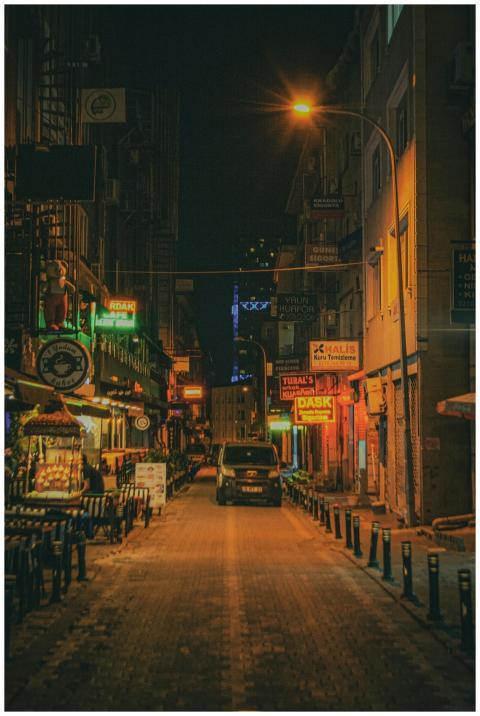 Explore a vibrant Istanbul street at night, adorne