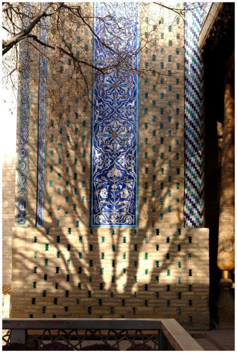 Beautiful mosaic patterns on an ancient wall with