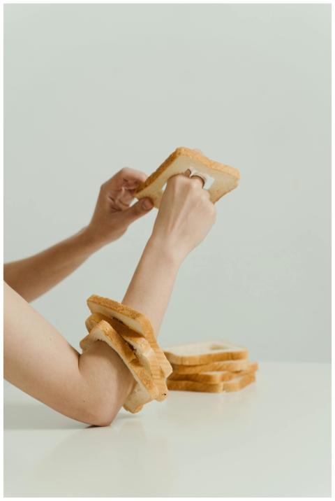 Artistic concept showing an arm adorned with bread