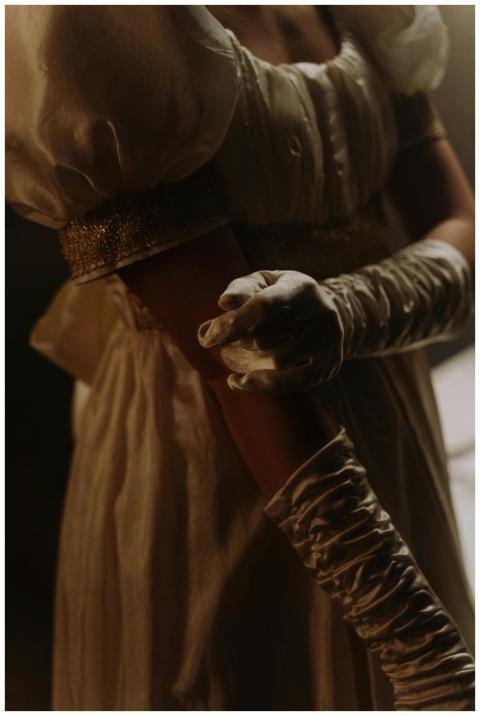 Close-up of a woman in a 19th-century empire style