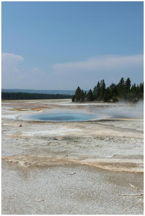 Stunning geothermal pool with steam in Yellowstone