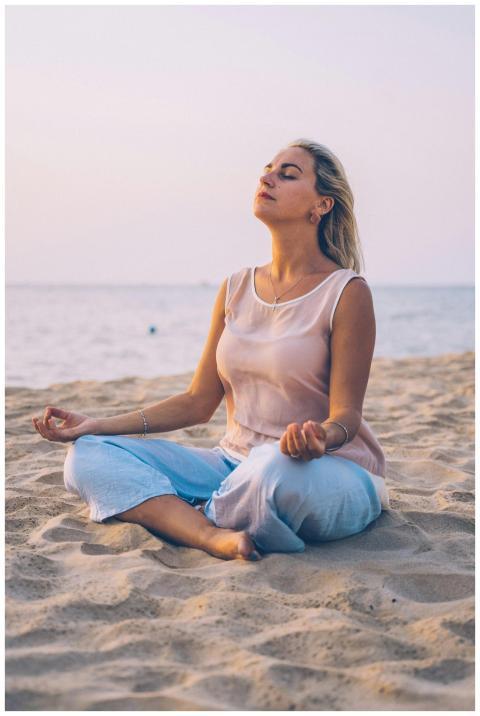 Meditating woman practicing mindfulness on a tranq