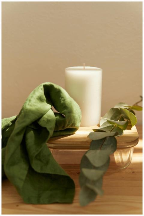 A tranquil still life featuring a soft-lit white c