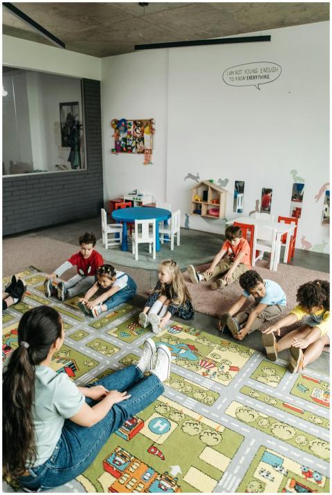 Kindergarten children participating in a classroom