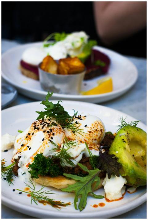 Delicious poached eggs served with avocado and fre