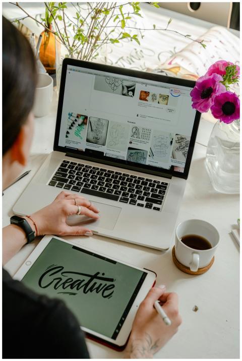 Creative work session featuring a woman using a ta