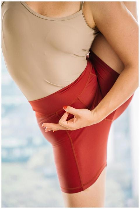 Close-up of a woman practicing an advanced yoga po