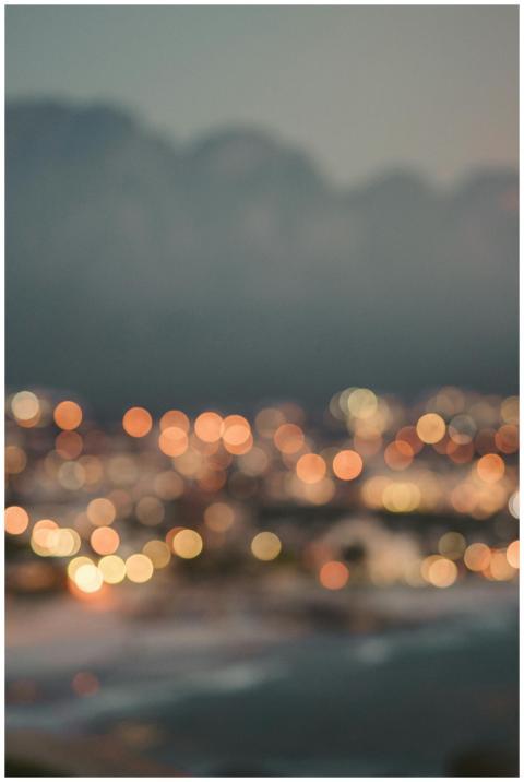 Blurry cityscape with colorful bokeh lights captur