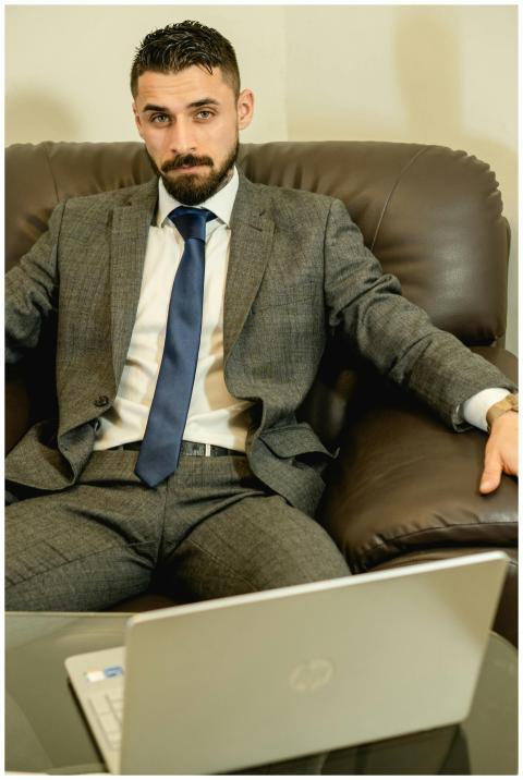 Confident business professional in gray suit with