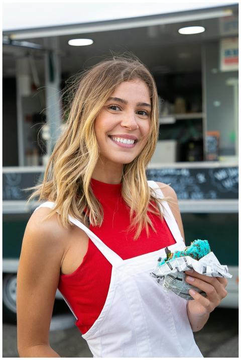 Happy woman with blond hair in casual clothes stan