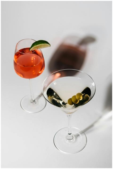Close-up of martini and spritz cocktails on a whit