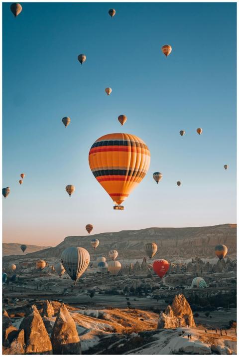 Majestic hot air balloons flying over Cappadocia,