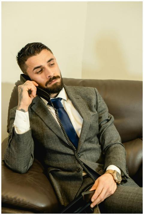 Businessman sitting on a sofa in an office making