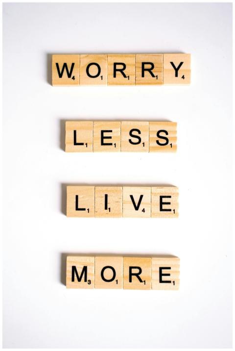 Motivational quote made from Scrabble tiles on a w