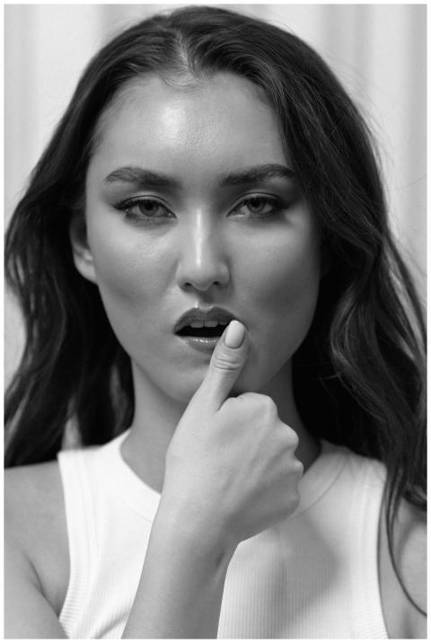 Close-up black and white portrait of a woman with