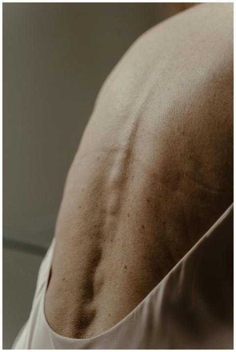 Detailed close-up of mature skin on a person's bac