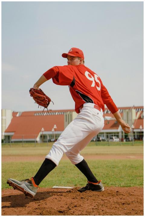 Dynamic action shot of a baseball player pitching