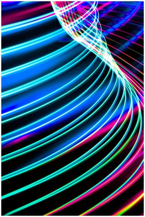 Dynamic abstract image of neon light trails creati