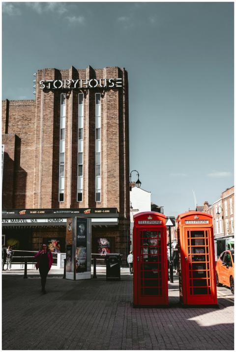 Historic red telephone booths outside Storyhouse T