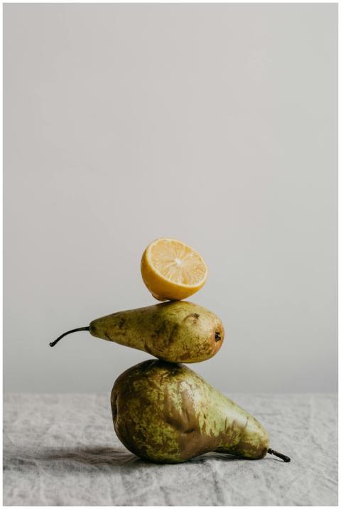 Minimalist still life composition featuring pears