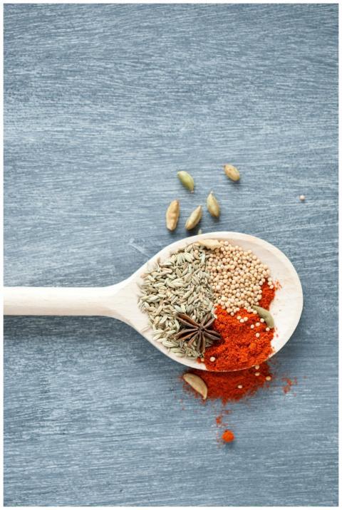 Top view of spices including star anise and chili