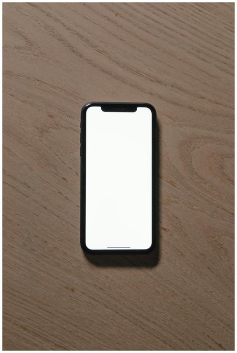 Vertical shot of a smartphone with a blank screen