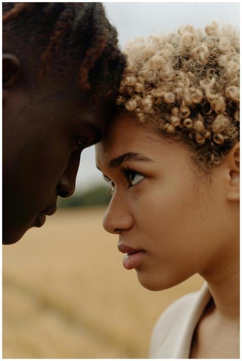 Close-up portrait of a couple sharing an intimate