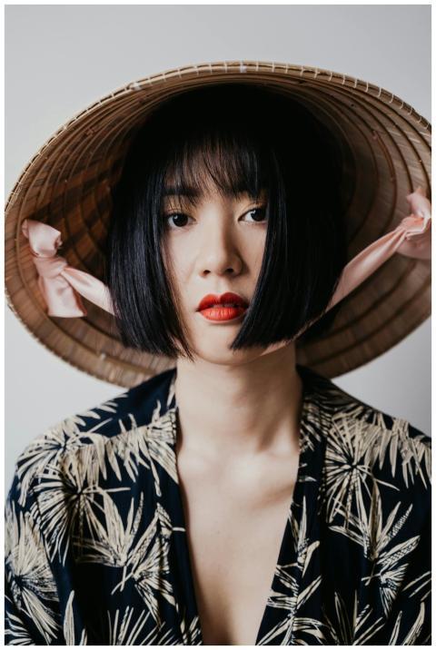 Close-up portrait of a woman with red lips and a t