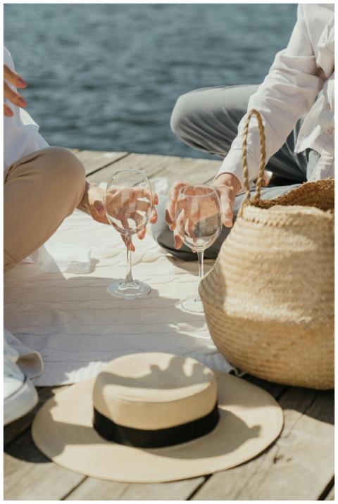 Couple enjoying a romantic picnic with wineglasses
