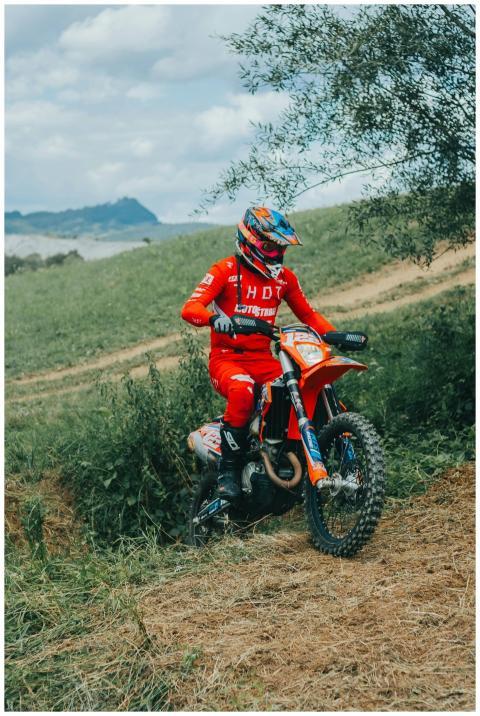 A rider on an off-road motorcycle participating in
