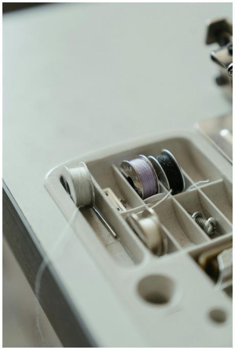 Detailed view of a sewing machine bobbin holder wi