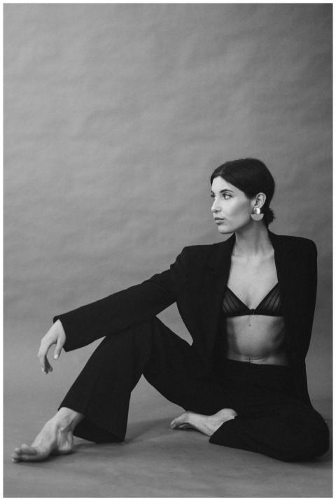 Elegant black-and-white fashion portrait of a woma