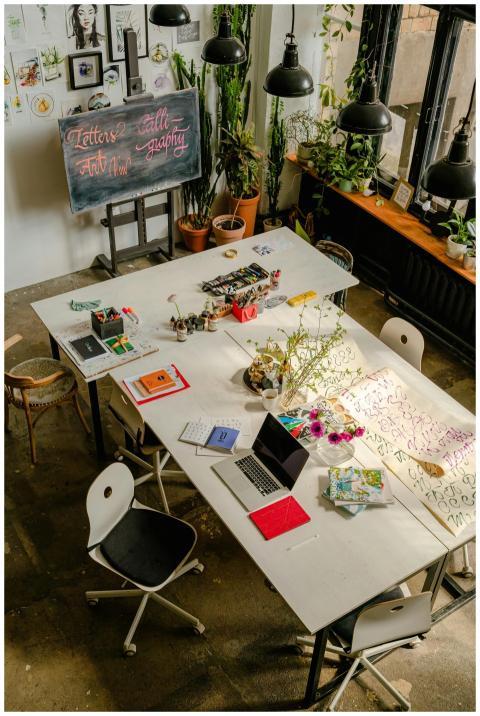 Overhead view of a creative art workspace featurin