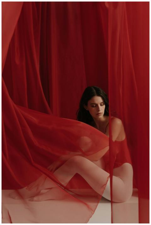 A portrait of a young woman surrounded by flowing